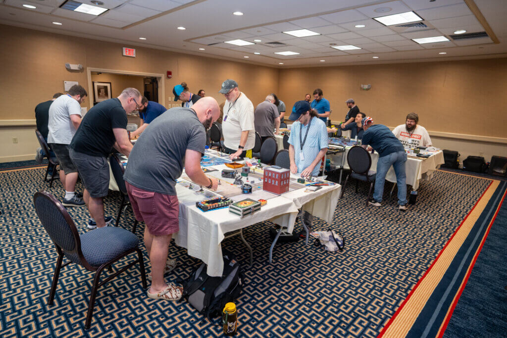 Dsc08656 Wicked Dicey Group of People Standing Around Tables Playing Tabletop Board Games in a Conference Room