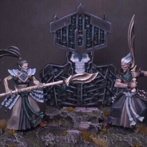 Two demon figures duel with staffs in a rocky, desolate diorama dominated by a gothic throne with skull accents, foregrounded by debris.