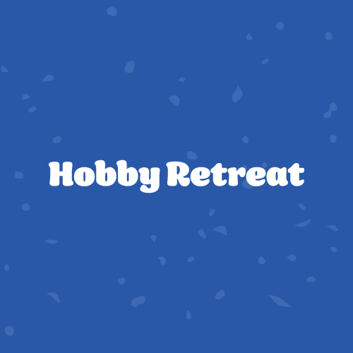 Hobby Retreat Wicked Dicey Logo Reading hobby Retreat in Bold White Letters on a Blue Background with Scattered Confetti